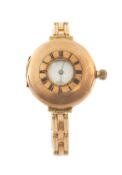 WALTHAM GOLD-PLATED HALF-HUNTER WATCH, later mounted on an expanding bracelet, signed white Roman