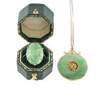 HONG KONG APPLE GREEN JADEITE DISC PENDANT, mounted in unmarked gold, 28mms (diam.), suspended