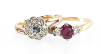 RUBY & DIAMOND RING, centred with an oval-cut ruby approx. 0.5cts, flanked by two smaller