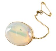 9CT GOLD & CABOCHON OPAL BROOCH, the stone approx. 19 x 14mms, in a plain collet mount with steel