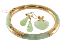 JADEITE & YELLOW METAL MOUNTED BANGLE, together with 9ct gold mounted jadeite heart pendant and