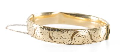 9CT METAL CORD HINGED BANGLE, cuff size 65mms Provenance: private collection Cheshire
