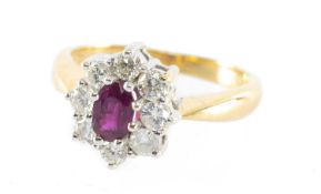 RUBY & DIAMOND CLUSTER RING, the oval-cut ruby approx. 0.5cts, bordered with brilliant-cut