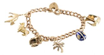 9CT GOLD CURB-LINK CHARM BRACELET with padlock clasp and safety chain, supporting six assorted