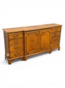 ARTHUR BRETT WALNUT BREAKFRONT SIDEBOARD, feather banded and cross banded top, two doors to
