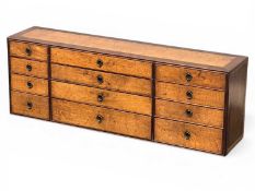 OAK & ROSEWOOD-BANDED TABLETOP CHEST, 19th century, having a bank of twelve drawers with recessed