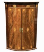 MAHOGANY & INLAID BOW-FRONT HANGING CORNER CUPBOARD, opening to three shaped shelves, 100 (h) x