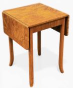 SATINWOOD DROP-LEAF OCCASIONAL TABLE, the top with striking veneers, cross banded and raised on
