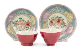 PAIR OF CHINESE FAMILLE ROSE TEA BOWLS & SAUCERS, Qianlong (1736-1795), finely decorated with