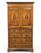 OAK LINEN PRESS, double doors with oval inlaid panels enclosing shelved interior, over two short and