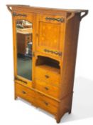 LIBERTY & CO. STYLE ARTS & CRAFTS OAK WARDROBE, mirror door to side, another door with floral