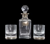 STERLING SILVER-MOUNTED HEAVY GLASS SCOTCH DECANTER, with vacant label; and two heavy silver-mounted
