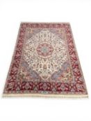 HAMADAN WOOLLEN RUG, signed, with fawn field and central flower head medallion, 203 x 144cms