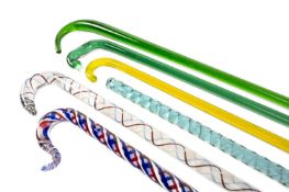 SIX VICTORIAN GLASS WALKING CANES, three Nailsea type with spiral decoration, 156cms the longest