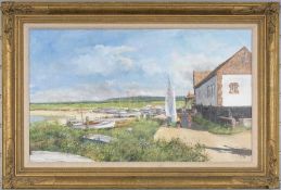 ‡ CLIVE MADGWICK (British, 1939-2005) oil on canvas - coastal scene with boats and figures, signed