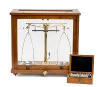 PHILIP HARRIS LTD., BIRMINGHAM, PRECISION CHEMIST'S SCALES, in glazed mahogany case with lift-up