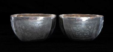 PAIR OF EASTERN WHITE METAL BOWLS, of square form, engraved with stylised motifs, 5.5 (h) x 9cms (