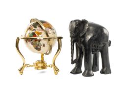 DECORATIVE HARDSTONE DESK GLOBE, framed in brass, 31cms (diam.); and an Indian carved ebony