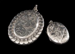 TWO OVAL SILVER LOCKETS, 55 x 40mms the largest, 30g gross Provenance: private collection Cheshire