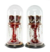 PAIR OF VICTORIAN RUBY GLASS LUSTRES with enamelled foliate decoration, 31.5cms (h), presented under