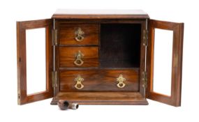 EDWARDIAN OAK SMOKER'S CABINET, glazed double doors enclosing interior with three drawers, 29 (h)