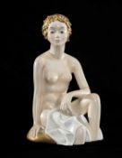 LENCI ART DECO ITALIAN CERAMIC FIGURE of a seated semi-nude female, with gold coloured hair and