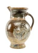 IMPRESSIVE WILLIE CARTER STUDIO POTTERY JUG, stylised floral design, on green mottled ground,