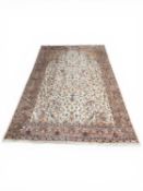 INDIAN TREE OF LIFE WOOLLEN RUG, signed, with fawn field detailed with birds amidst branches, within