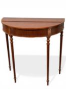 ARTHUR BRETT DEMILUNE MAHOGANY CONSOLE TABLE, cross banded top over a fluted frieze, on fluted