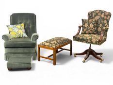 ARTHUR BRETT SWIVEL ARMCHAIR, with green floral fabric upholstery; low rectangular stool with
