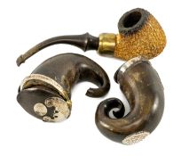 TWO SCOTTISH RAM'S HORN SNUFF MILLS, with white metal mounts, one monogrammed 'C.M.'; and a carved