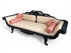 ANGLO-INDIAN CARVED EBONISED SETTEE, late 19th century, cream floral upholstery, 88 (h) x 240 (w)