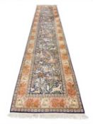 QUALITY SILK RUNNER, in the Persian style, India, late 20th century, having a pictorial hunting blue