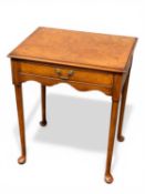 ARTHUR BRETT WALNUT CENTRE TABLE, rectangular top with moulded rim, over frieze drawer, brass drop
