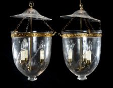 PAIR OF ENGRAVED GLASS & BRASS HANGING STORM LANTERNS, each with three-lamp fitting, 46cms drop,