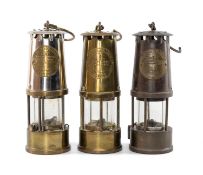 THREE MINER'S LAMPS, all marked 'The Protector Lamp & Lighting Co. Ltd.', Eccles, comprising Type