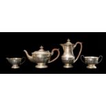 SILVER FOUR-PIECE TEA SERVICE, Birmingham 1931, half fluted, with bakelite handles and knops,