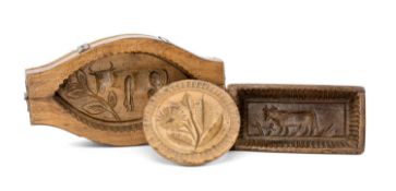 THREE 19TH CENTURY SYCAMORE BUTTER PRESSES, comprising circular press with waisted handle carved