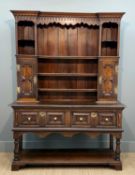 ANTIQUE OAK HIGH DRESSER, boarded plate rack, shaped pelmet, central shelves flanked by cupboards,
