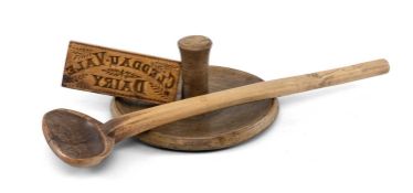 ANTIQUE TREEN ITEMS comprising Cleddau Vale dairy butter press, 15cms (w); large cowl spoon (