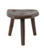 CHILD'S MILKING STOOL probably early 19th century, tripod with tapering straight legs pierced and