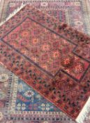 TWO EASTERN RUGS, multiple patterns throughout, red ground, 190 x 130cms and 133 x 91cms (2)