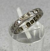 DIAMOND ETERNITY RING, set in white metal, one stone missing, size K, 1.4g Provenance: private