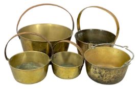 FIVE 19TH CENTURY BRASS SKILLETS, 31cms the larger Provenance: private collection Ynys Môn
