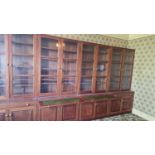 20TH CENTURY HARDWOOD BOOKCASE CUPBOARDS, the top four sections all with twin glazed doors, bases