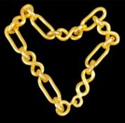 YELLOW METAL BRACELET, with alternating oblong and textured infinity-shaped links, stamped '750',