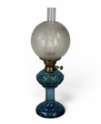 UNUSUAL TURQUOISE GLASS OIL LAMP, with twin burners, globular etched glass shade, 55cms (h)