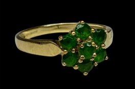 9CT GOLD RING, set with a cluster of green stones, stamped 'QVC', 2.2g Provenance: deceased estate