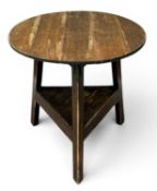 OAK AND PINE CRICKET TABLE, with base shelf, 75 (h) x 74cms (diam.) Provenance: private collection
