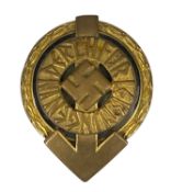 WWII GERMAN THIRD REICH HITLER YOUTH BADGE, gilt metal and black enamel, featuring a Swastika within